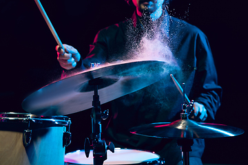 Image showing Drummer\'s rehearsing on drums before rock concert. Man recording music on drumset in studio