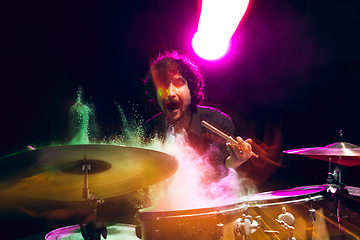 Image showing Drummer\'s rehearsing on drums before rock concert. Man recording music on drumset in studio