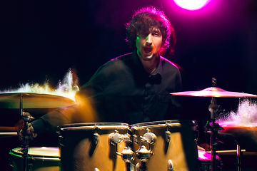 Image showing Drummer\'s rehearsing on drums before rock concert. Man recording music on drumset in studio