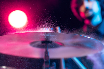 Image showing Drummer\'s rehearsing on drums before rock concert. Man recording music on drumset in studio