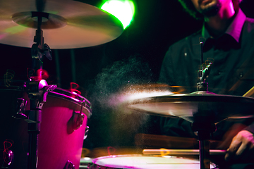 Image showing Drummer\'s rehearsing on drums before rock concert. Man recording music on drumset in studio