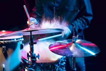 Image showing Drummer\'s rehearsing on drums before rock concert. Man recording music on drumset in studio