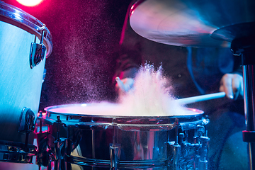 Image showing Drummer\'s rehearsing on drums before rock concert. Man recording music on drumset in studio