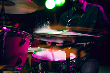 Image showing Drummer\'s rehearsing on drums before rock concert. Man recording music on drumset in studio