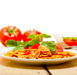 Image showing Italian pasta farfalle butterfly bow-tie and tomato sauce