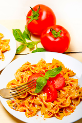 Image showing Italian pasta farfalle butterfly bow-tie and tomato sauce