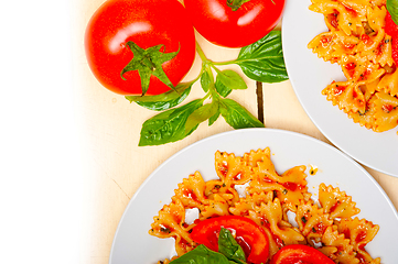 Image showing Italian pasta farfalle butterfly bow-tie and tomato sauce