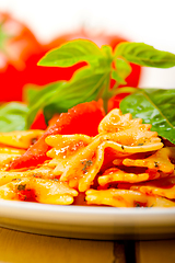 Image showing Italian pasta farfalle butterfly bow-tie and tomato sauce