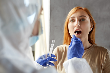 Image showing doctor in protective wear making coronavirus test