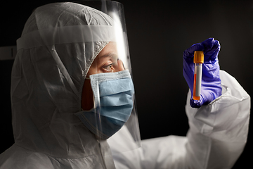 Image showing scientist in mask and face shield with test tube