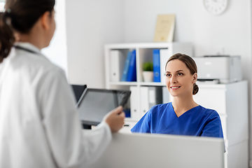 Image showing doctor with tablet computer and nurse at hospital