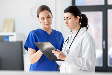 Image showing doctor and nurse with clipboard at hospital