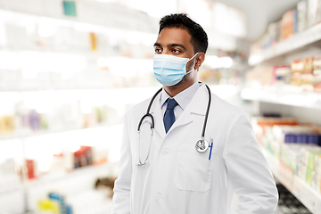 Image showing indian male doctor in medical mask at pharmacy