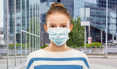 Image showing teenage girl in medical mask over city street