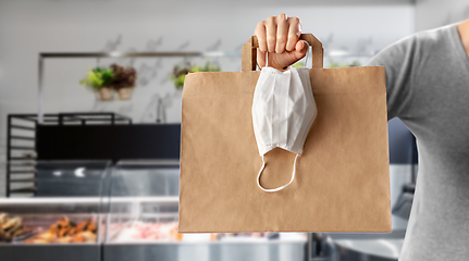 Image showing woman with food in bag and mask at grocery store