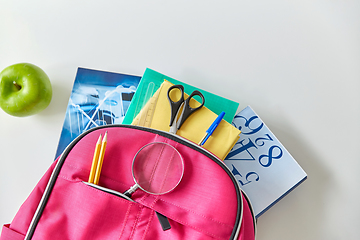 Image showing backpack with books, school supplies and apple