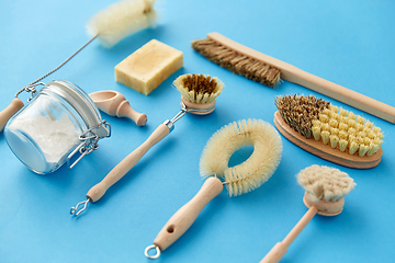 Image showing cleaning brushes and soda powder with scoop in jar