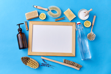 Image showing natural cleaning supplies around white board