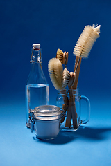 Image showing washing soda, bottle of vinegar and brushes