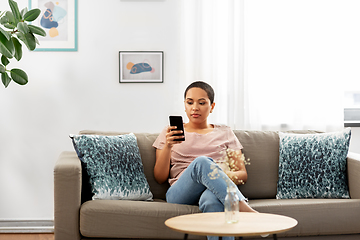 Image showing african american woman with smartphone at home