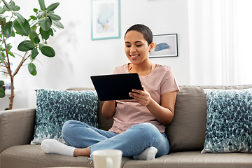 Image showing african american woman with tablet pc at home