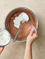 Image showing process of making dough for chocolate cake