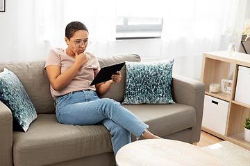 Image showing african american woman with tablet pc at home