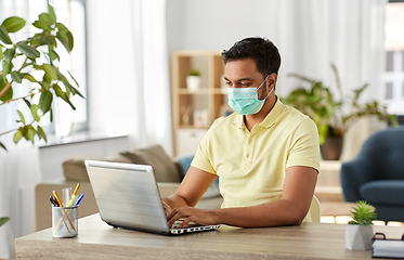 Image showing indian man in mask with laptop at home office