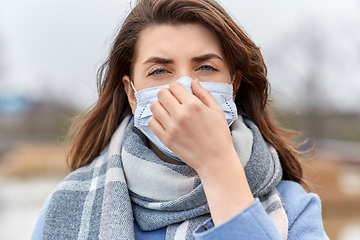 Image showing young woman wearing protective medical mask