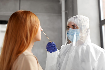 Image showing doctor in protective wear making coronavirus test