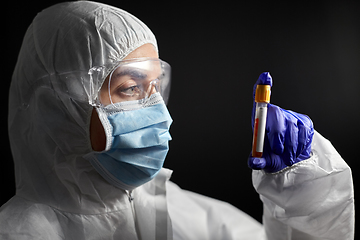 Image showing scientist in protective mask with test tube