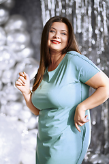 Image showing Happy plus size woman dancing