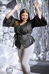 Image showing Happy plus size woman dancing at the party