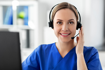 Image showing doctor with headset and computer at hospital