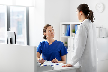 Image showing doctor and nurse with clipboard at hospital