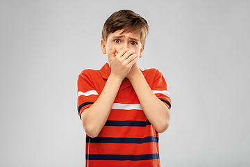 Image showing scared boy clothing mouth with hands