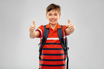 Image showing happy student boy with backpack showing thumbs up