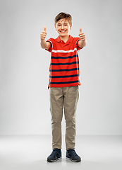 Image showing happy boy in red polo t-shirt showing thumbs up