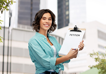 Image showing smiling woman with petition on clipboard and pen