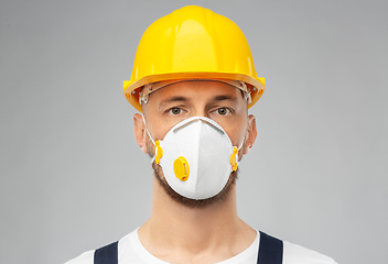 Image showing male worker or builder in helmet and respirator