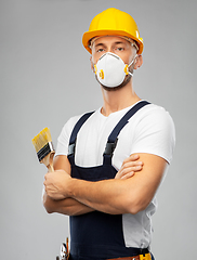 Image showing male worker or builder in helmet and respirator