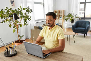 Image showing indian man with laptop working at home office