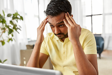 Image showing indian man with laptop working at home office