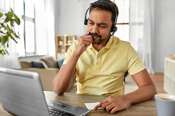 Image showing indian man with headset and laptop working at home