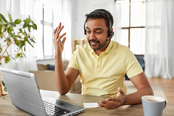 Image showing indian man with headset and laptop working at home