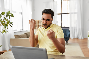 Image showing indian man with laptop working at home office