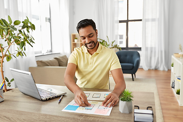 Image showing male ui designer working on user interface at home