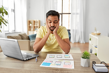 Image showing male ui designer working on user interface at home