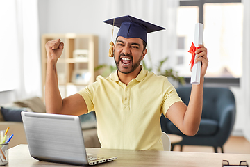 Image showing indian student with laptop and diploma at home