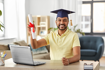 Image showing indian student with laptop and diploma at home